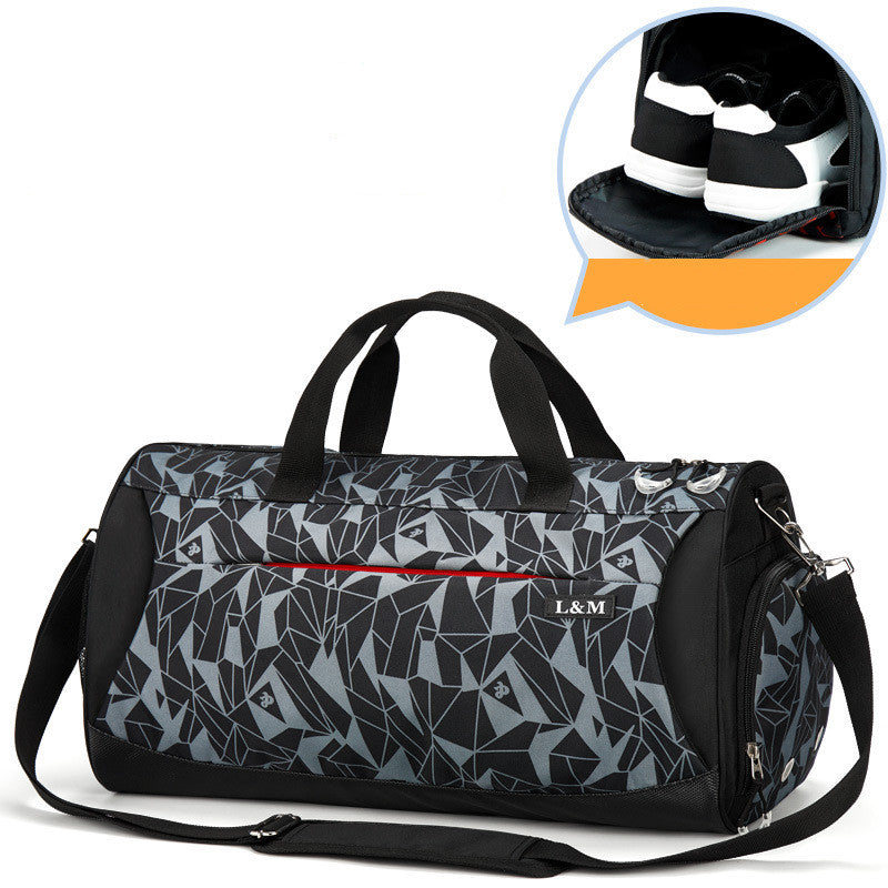 gray geometric patterned duffel bag with black accents on a white background